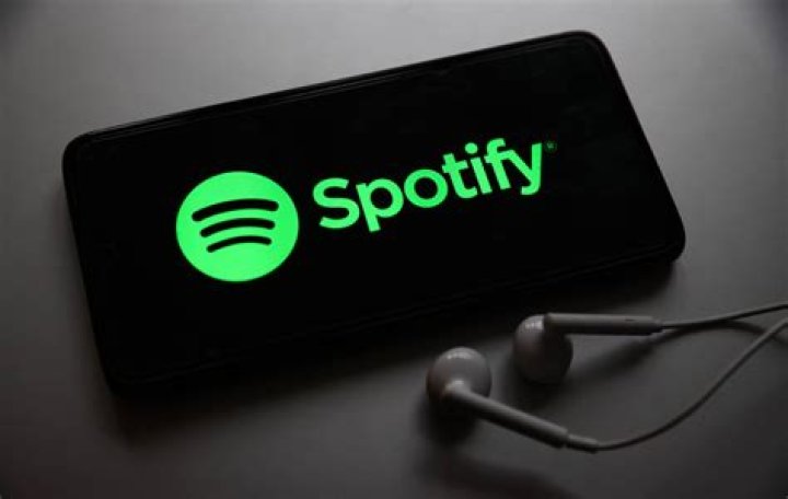 A Spotify logo with headphones on it. 