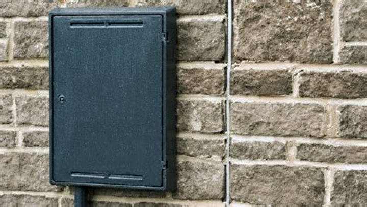 Meter boxes on a wall of an old building