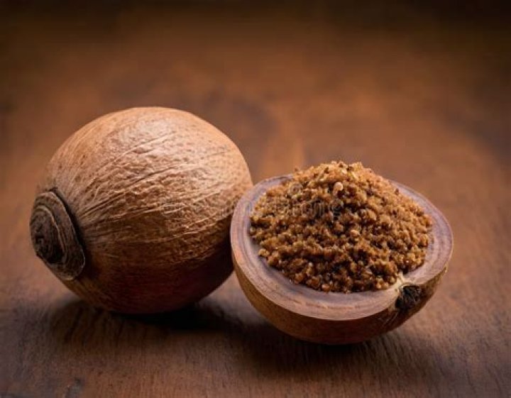 Nutmeg on a wooden surface Nutmeg on a wooden surface